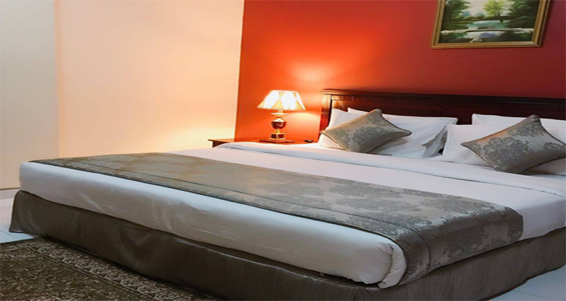 Bedside table and lamp in a suite